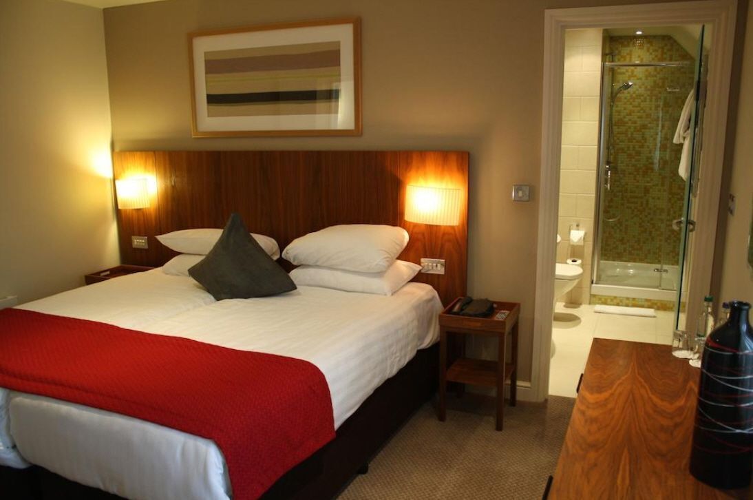 Premium bedding, desk, laptop workspace, iron/ironing board