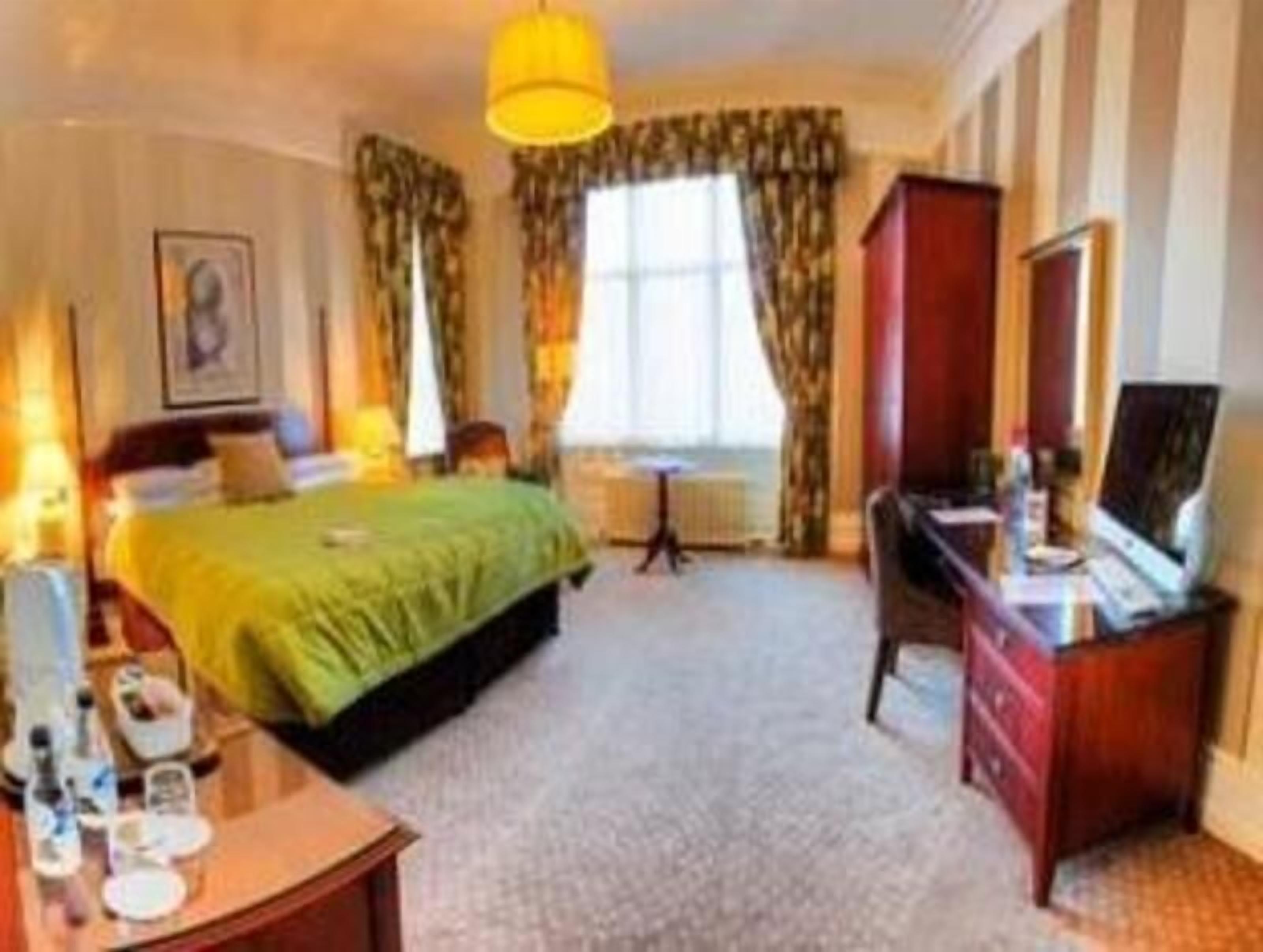 Premium bedding, desk, laptop workspace, iron/ironing board