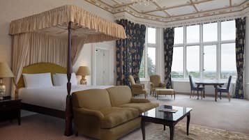 Premium bedding, desk, laptop workspace, iron/ironing board