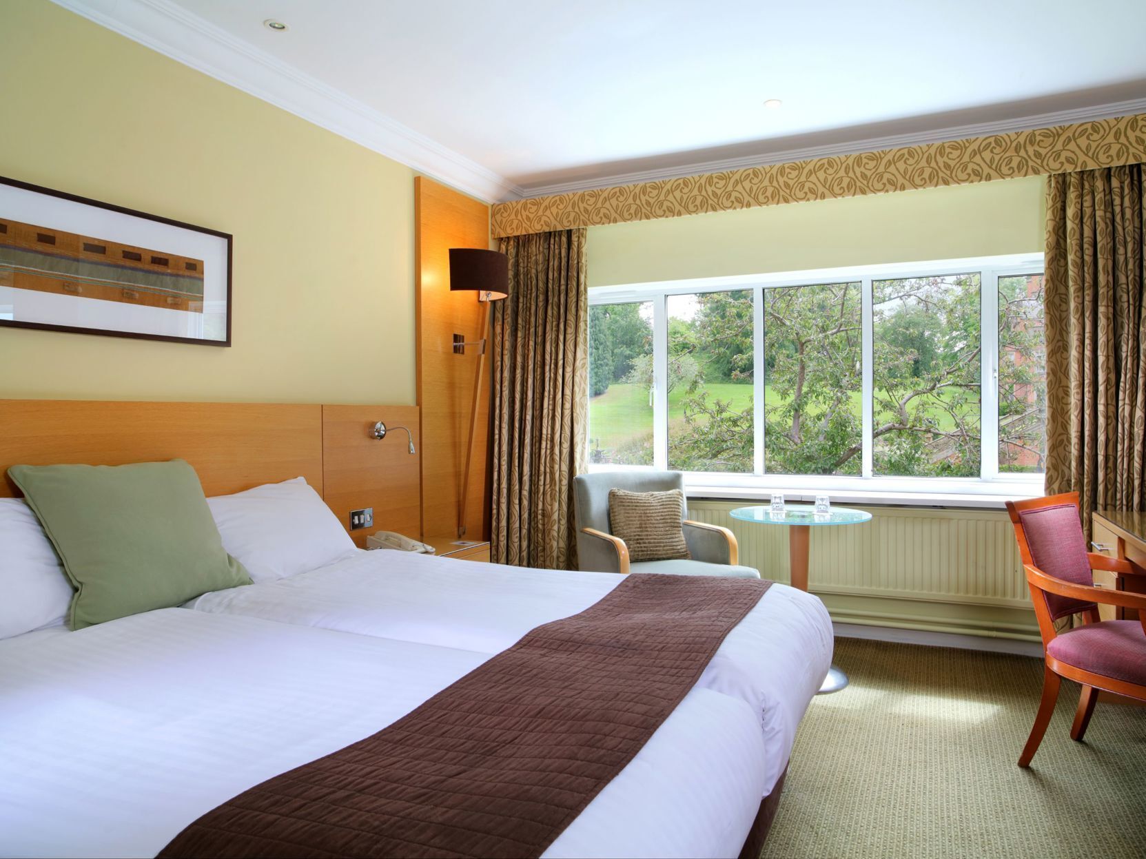 Premium bedding, desk, laptop workspace, iron/ironing board