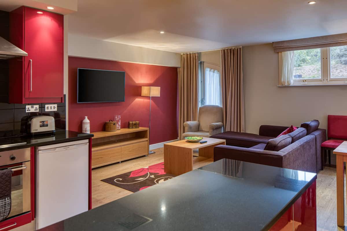 premium bedding, desk, laptop workspace, iron/ironing board