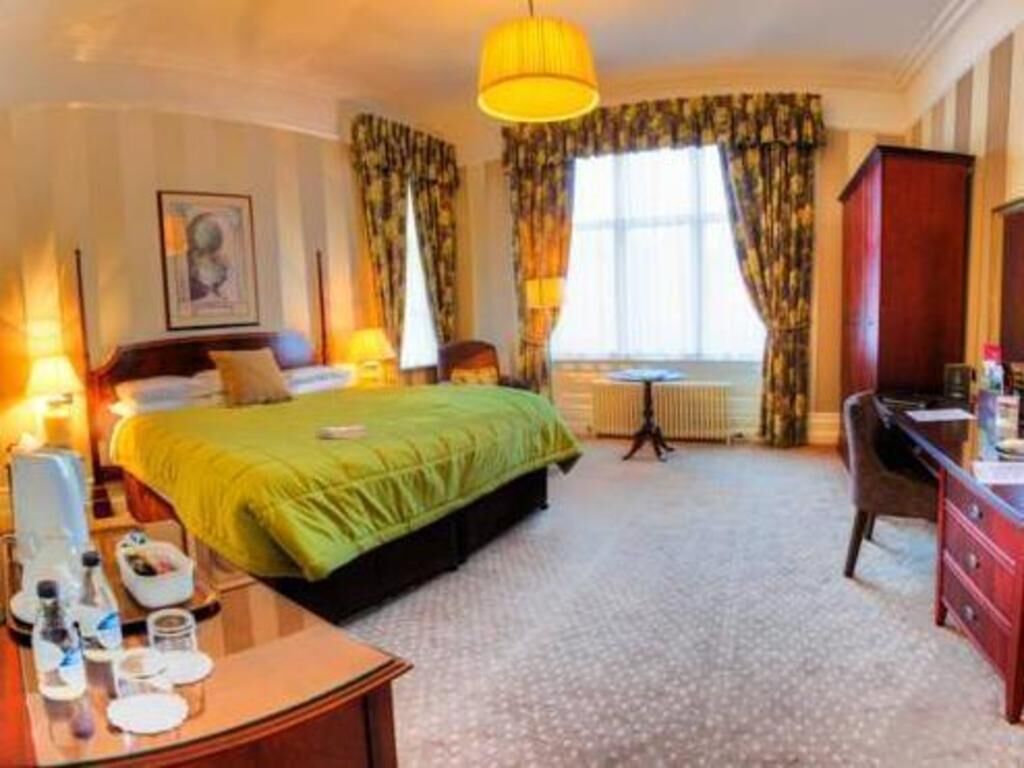 Premium bedding, desk, laptop workspace, iron/ironing board