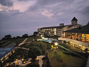 A hotel with multiple floors, a swimming pool, and a tower. - Resort Olivean Shodoshima (Tonosho)