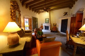 Presidential Suite, 1 King Bed (Presidential Villa) | Living area | Fireplace - Hacienda de los Santos (Alamos)