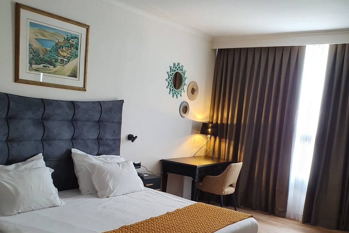 Deluxe Double Room | Minibar, in-room safe, desk, free cots/infant beds