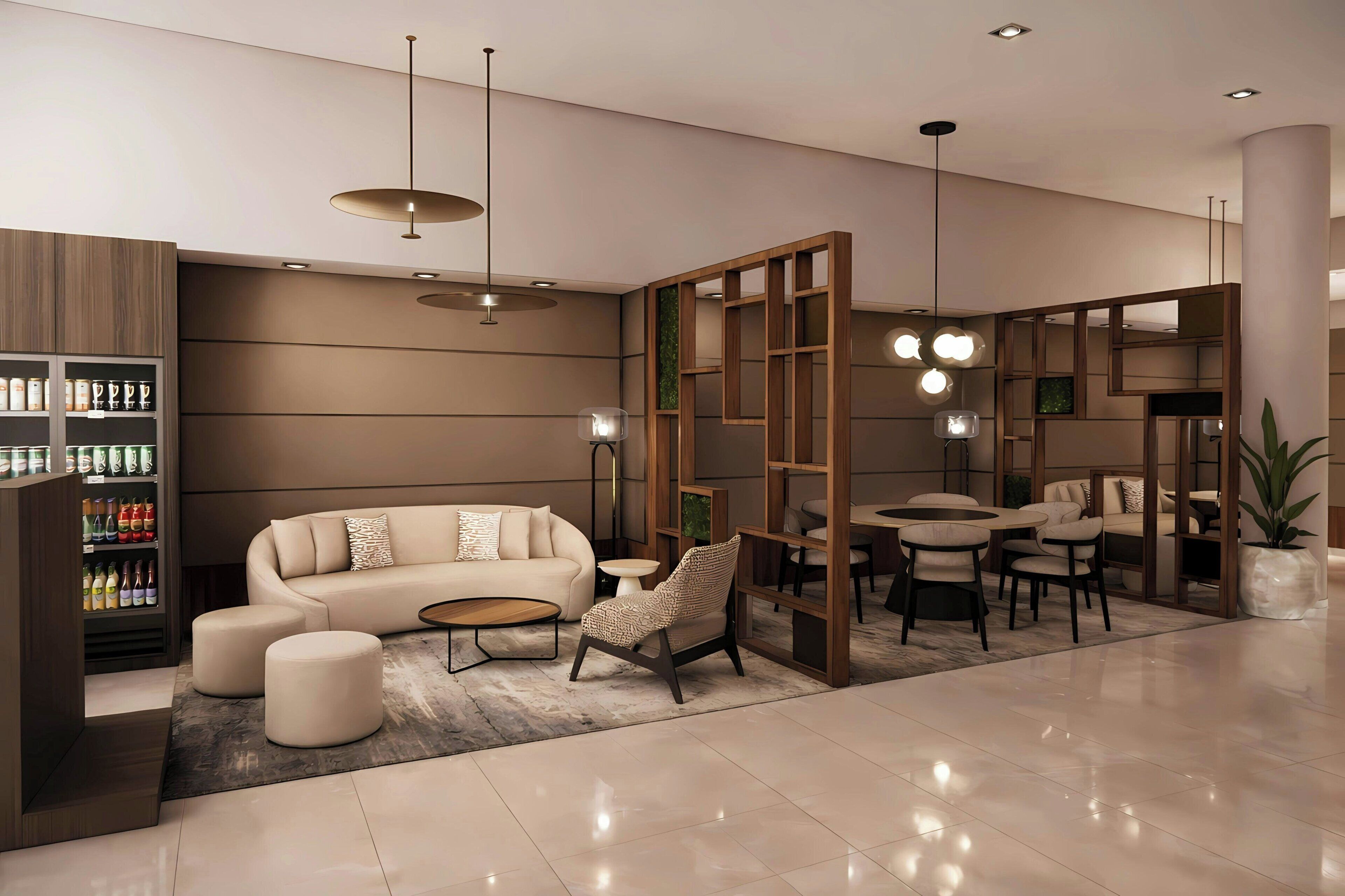 A modern living room with a sofa, ottoman, and a coffee table. There is a bookshelf with various items and a dining area with chairs and a table.