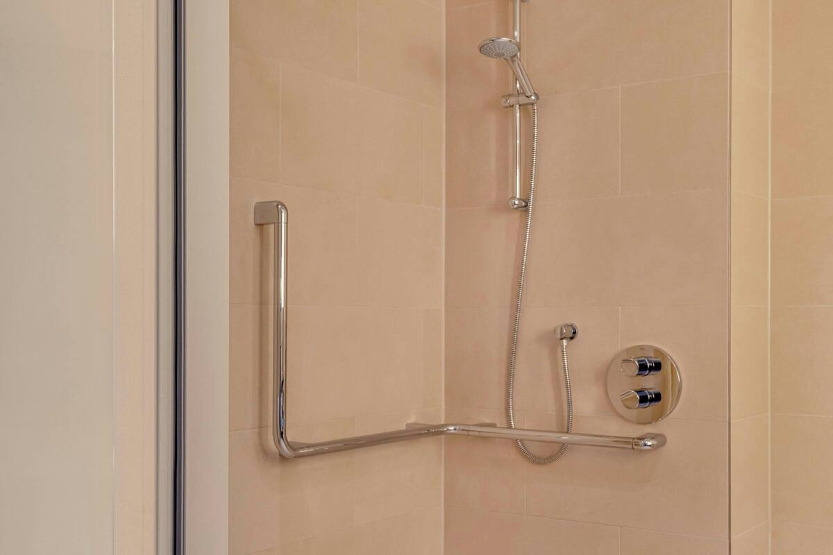 combined shower/bathtub, free toiletries, hair dryer, bathrobes