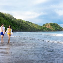 On the beach, black sand, free beach cabanas, sun loungers