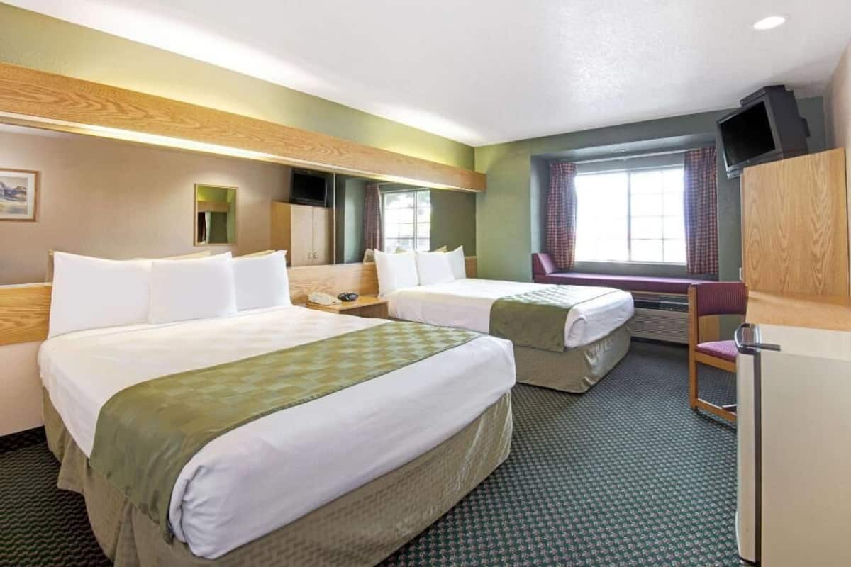 Pillow-top beds, desk, blackout curtains, WiFi