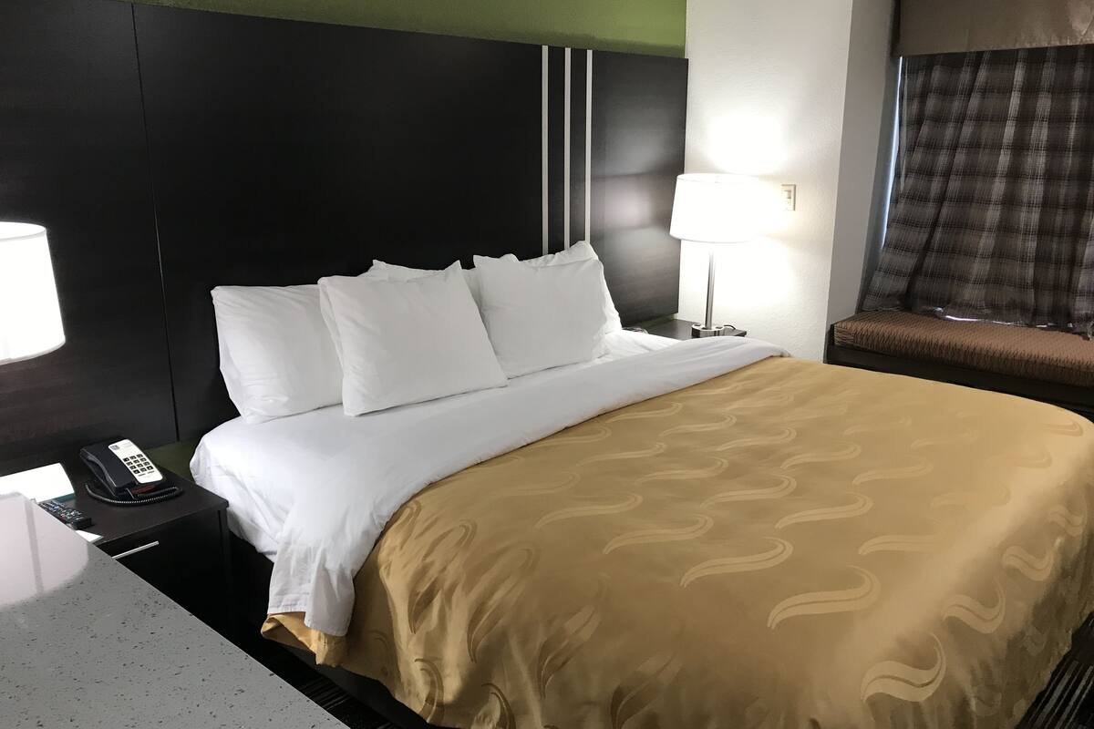 suite, 1 king bed, non smoking | premium bedding, desk, blackout curtains, iron/ironing board