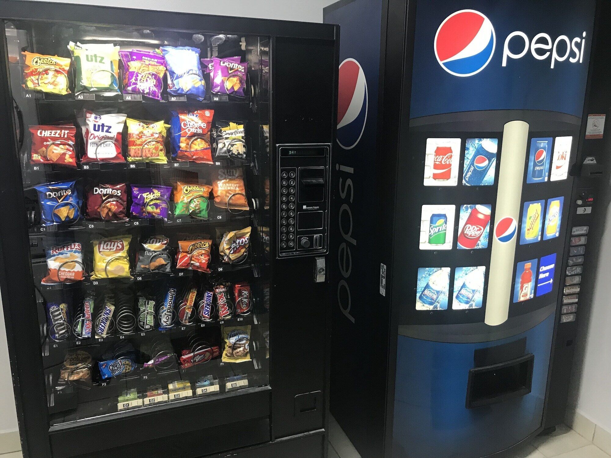 A vending machine with various snacks and a Pepsi dispenser.