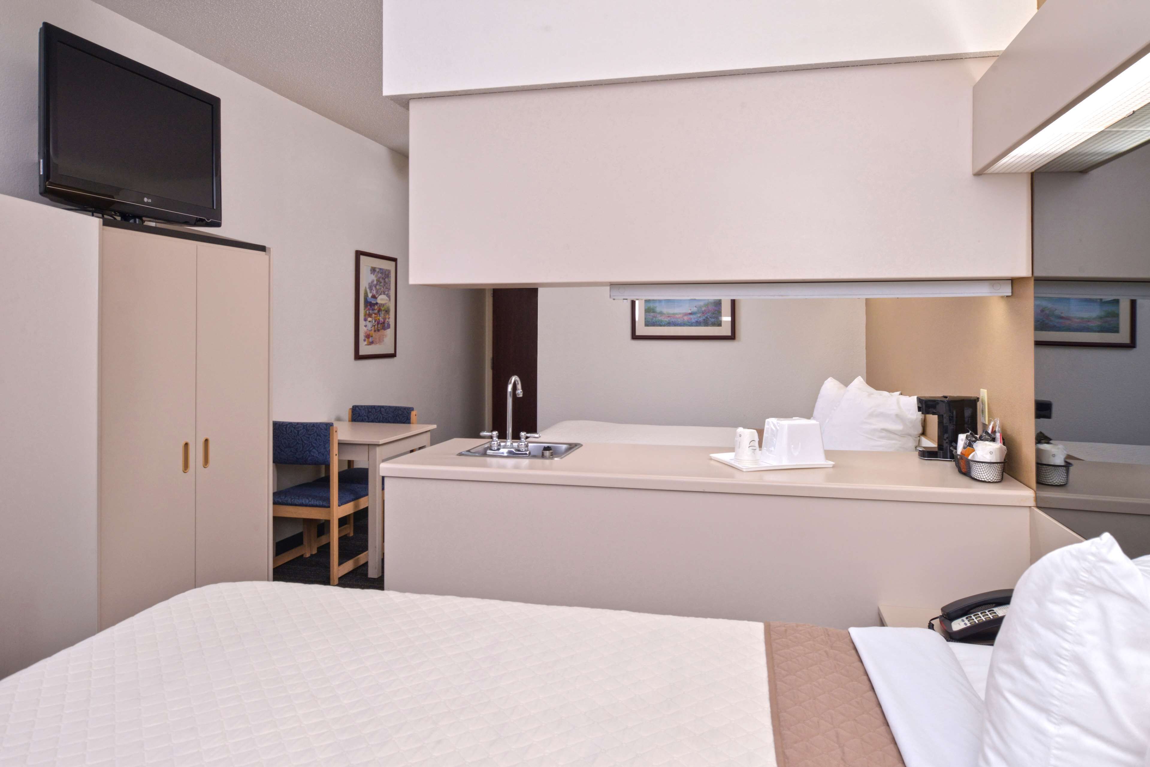 suite, 2 queen beds, non smoking | in-room safe, desk, blackout curtains, iron/ironing board