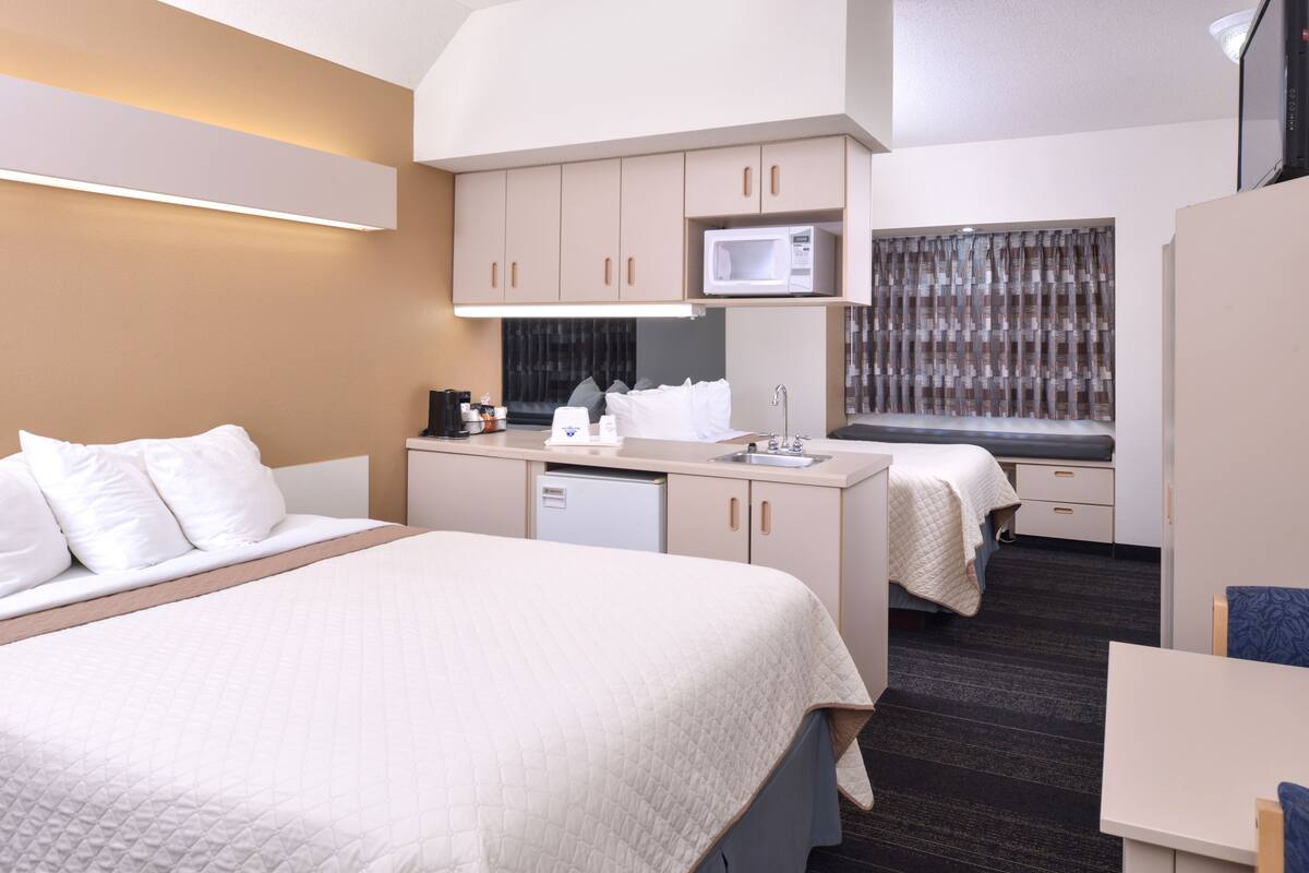 suite, 2 queen beds, non smoking | in-room safe, desk, blackout curtains, iron/ironing board