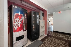 A vending machine area with a Dr. Pepper machine and a water dispenser. - Red Roof Inn Springfield, MO (Springfield)