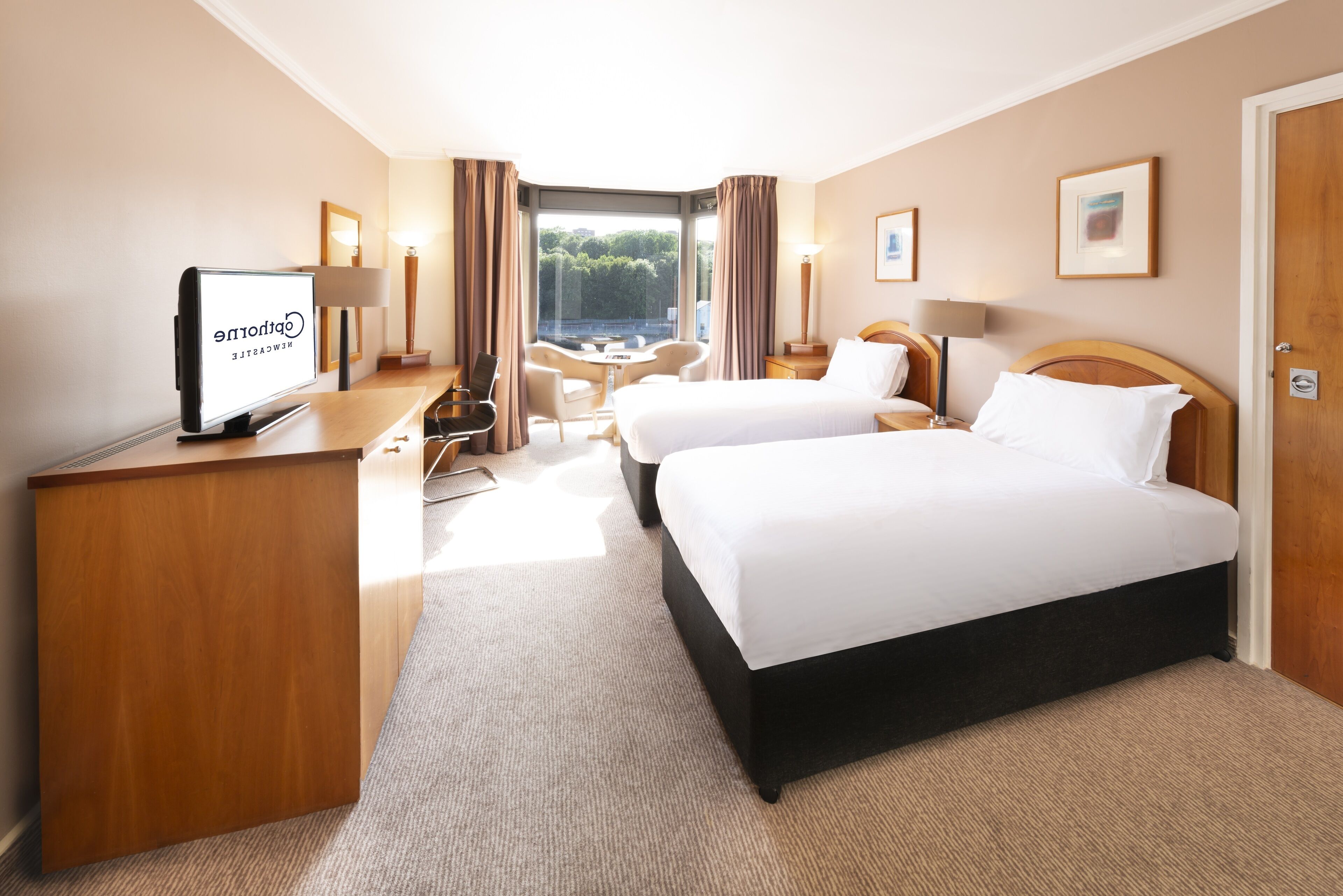 standard twin room | in-room safe, desk, laptop workspace, iron/ironing board