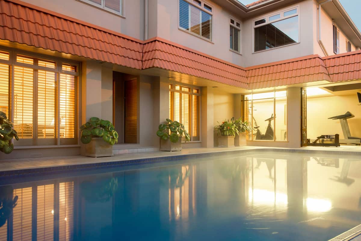 outdoor pool, a heated pool, open 7:00 am to 8:00 pm, pool loungers