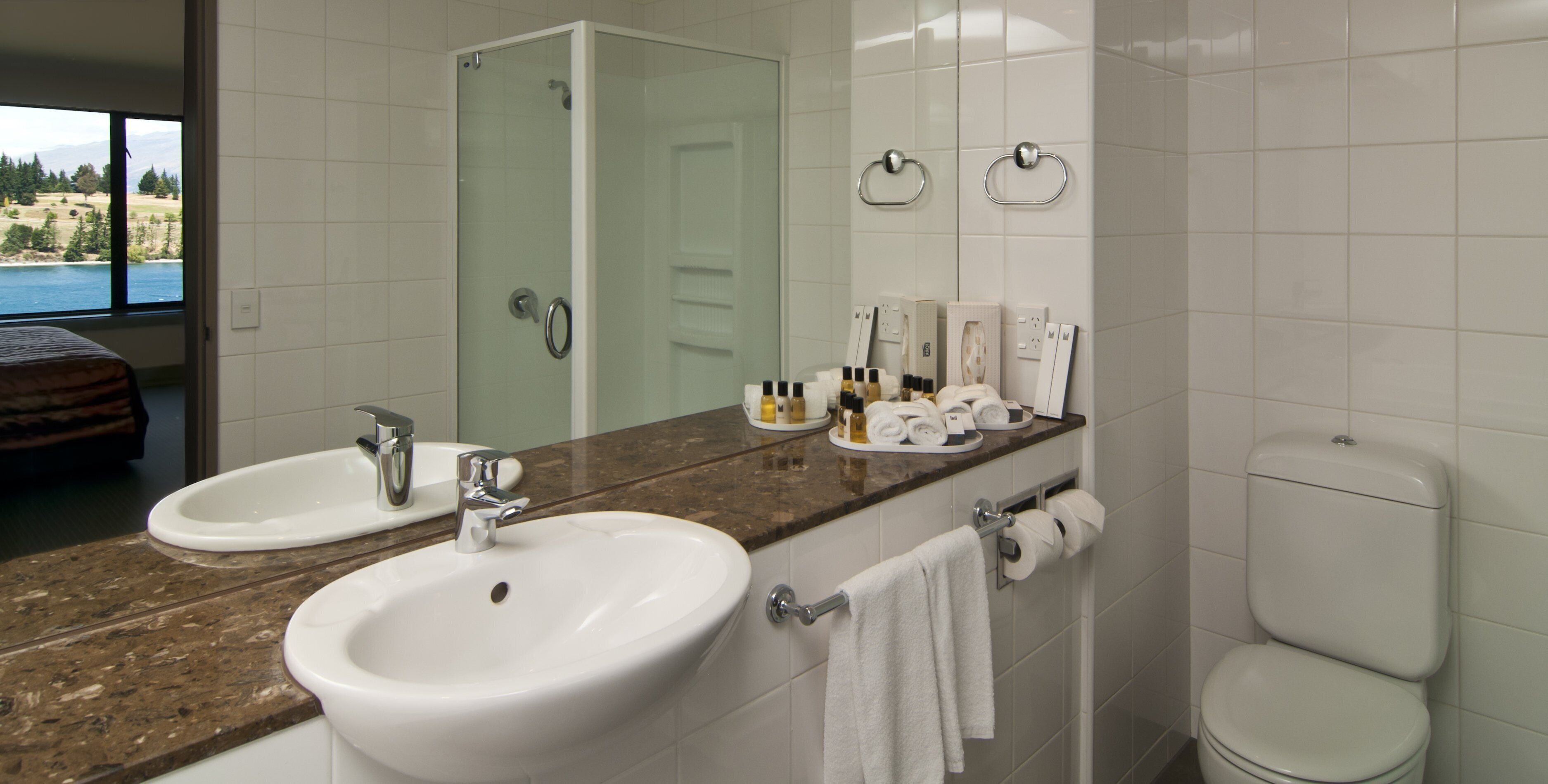 eco-friendly toiletries, hair dryer, towels