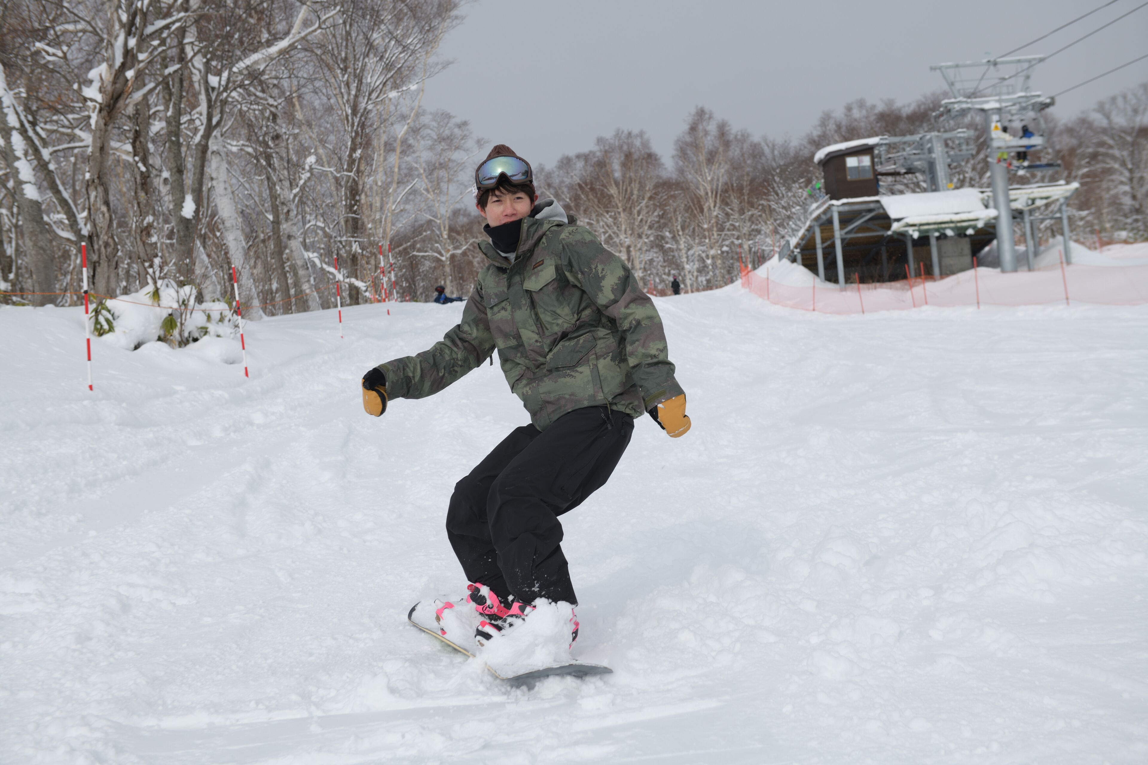 A person snowboarding on a snowy slope.