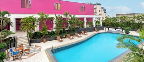 Outdoor pool, open 7:00 AM to 9:00 PM, pool umbrellas, sun loungers