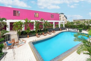 Outdoor pool, open 7:00 AM to 9:00 PM, pool umbrellas, sun loungers