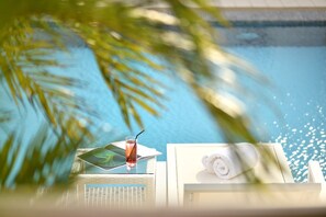 Outdoor pool, open 7:00 AM to 9:00 PM, pool umbrellas, pool loungers