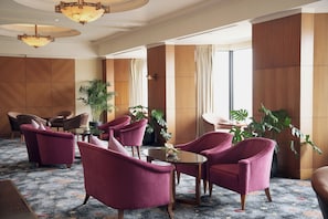 A lobby with seating, a chandelier, and large windows. - Hotel du Parc Hanoi (Hanoi)