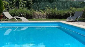 Seasonal outdoor pool, open 10:00 AM to 8:00 PM, pool umbrellas