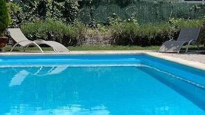 Seasonal outdoor pool, open 10:00 AM to 8:00 PM, pool umbrellas