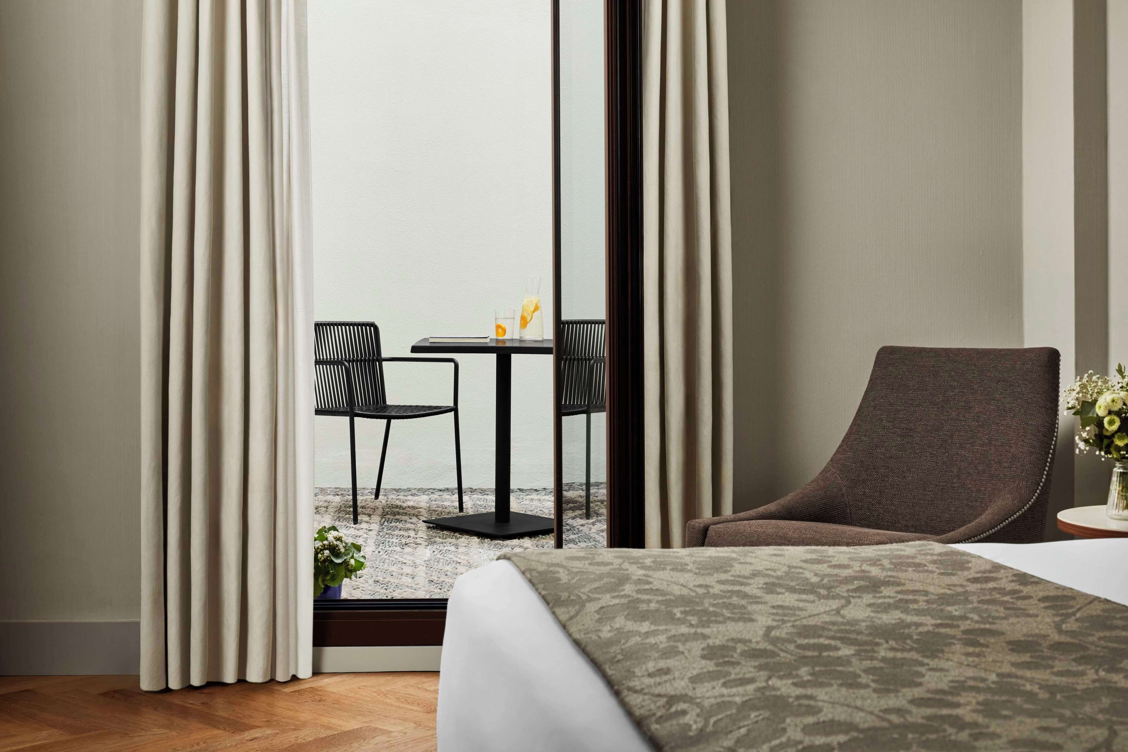 Premium Room (Patio) | Minibar, in-room safe, desk, blackout curtains