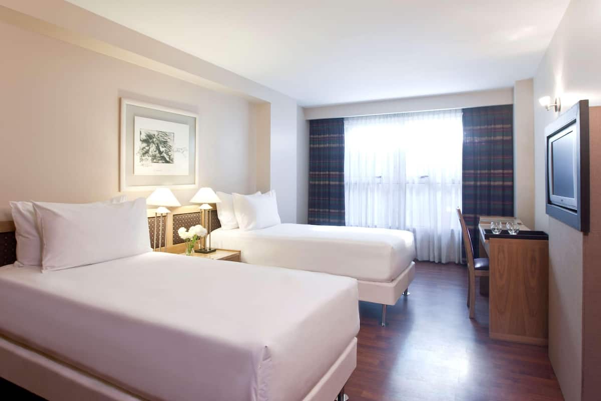 Premium bedding, down comforters, pillowtop beds, minibar