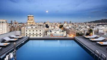 Outdoor pool, open 8:00 AM to 8:00 PM, pool umbrellas, pool loungers