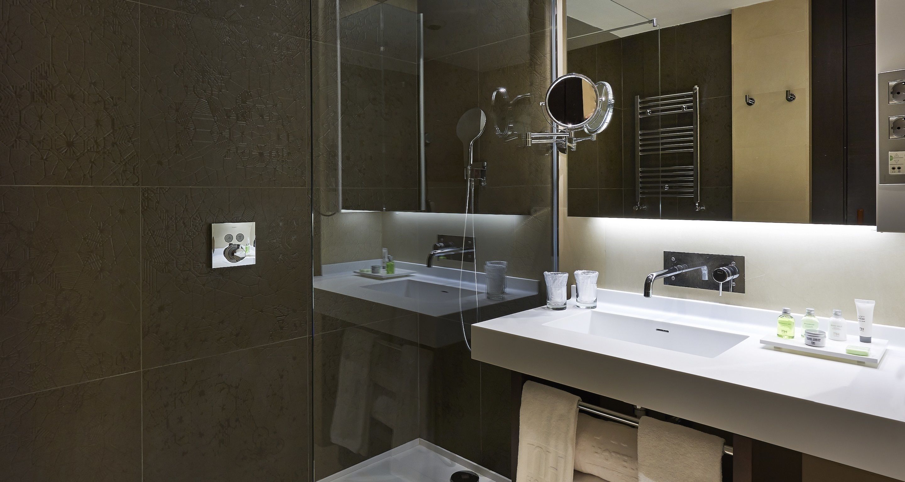 rainfall showerhead, eco-friendly toiletries, hair dryer, slippers