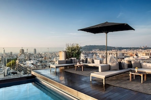 Outdoor pool, open 8:00 AM to 8:00 PM, pool umbrellas, pool loungers