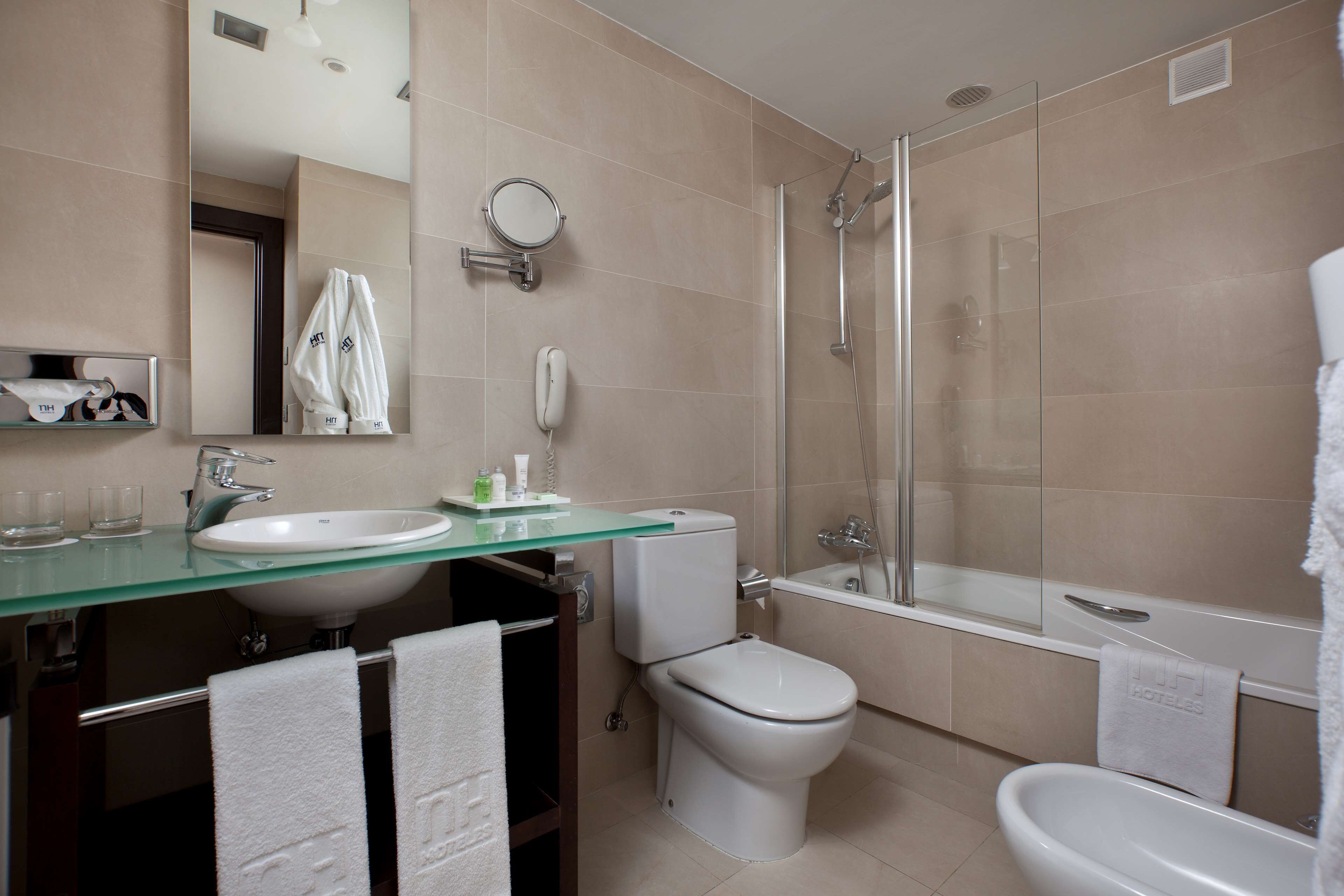 bathtub, eco-friendly toiletries, hair dryer, bidet