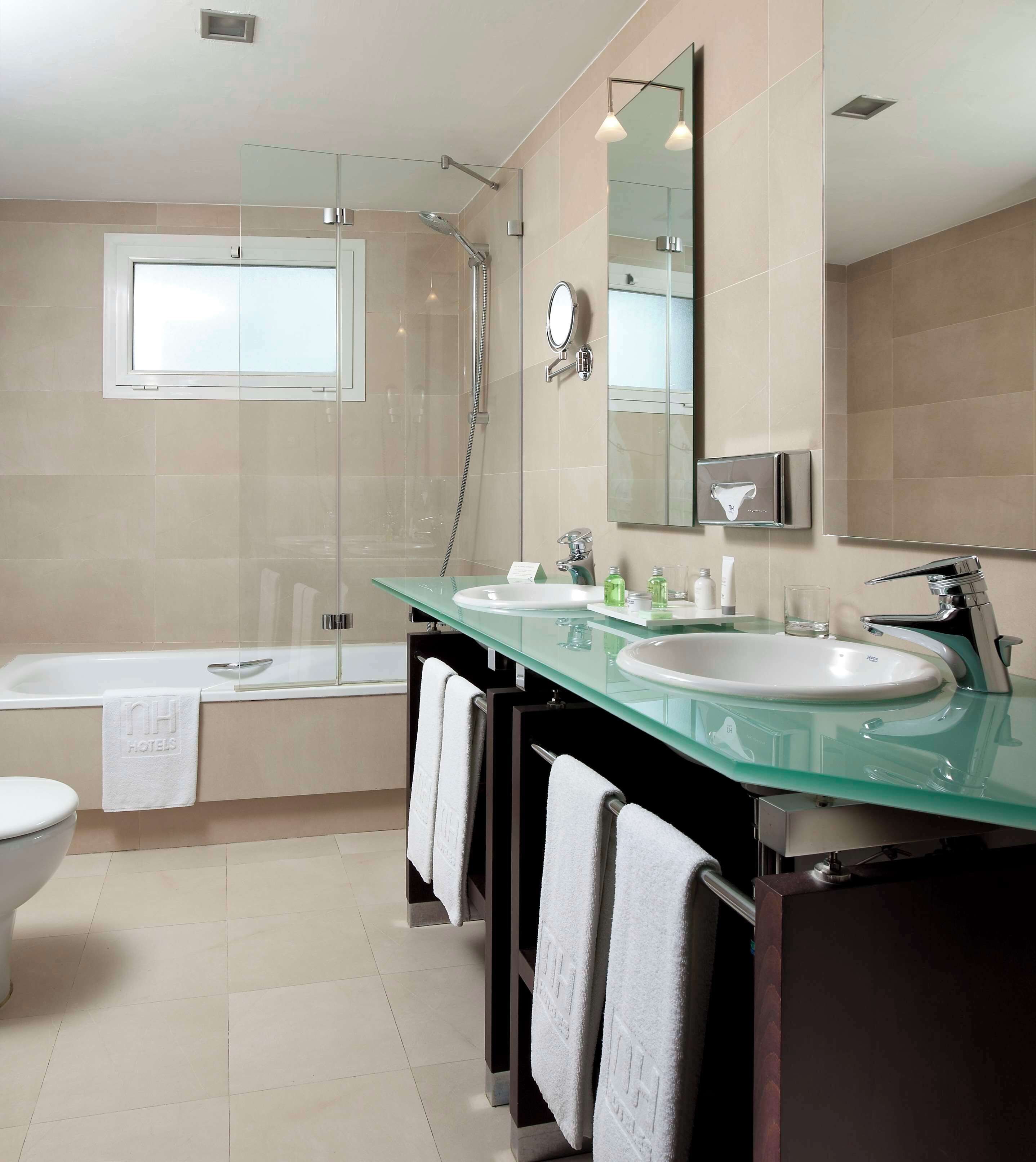 bathtub, eco-friendly toiletries, hair dryer, bidet