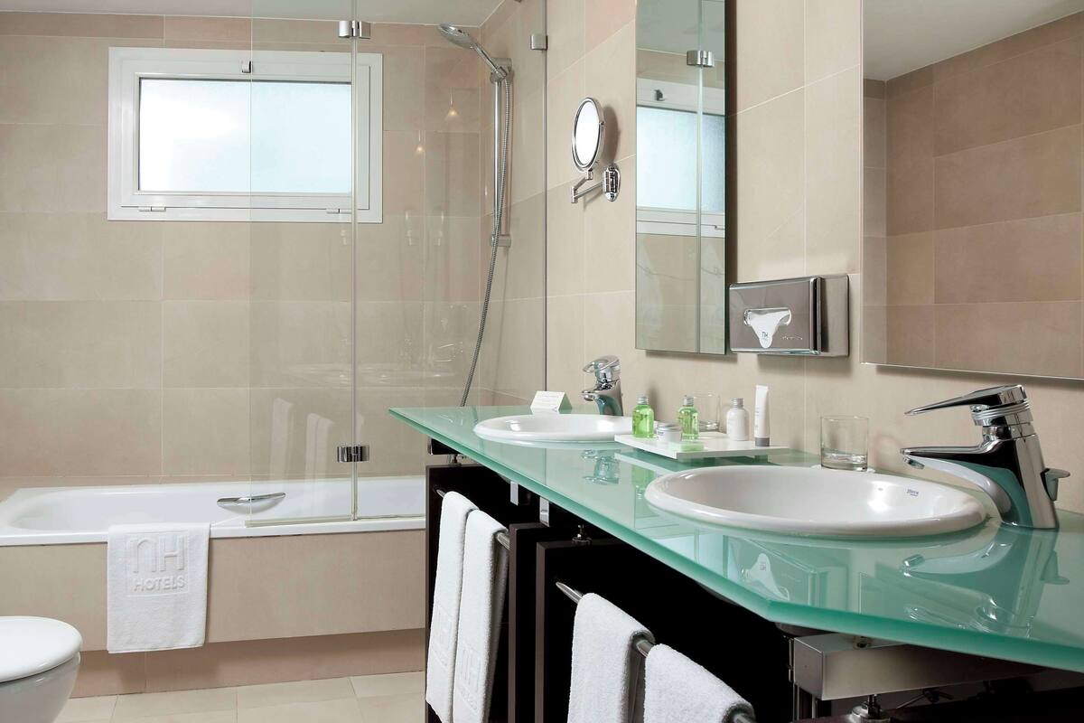 bathtub, eco-friendly toiletries, hair dryer, bidet