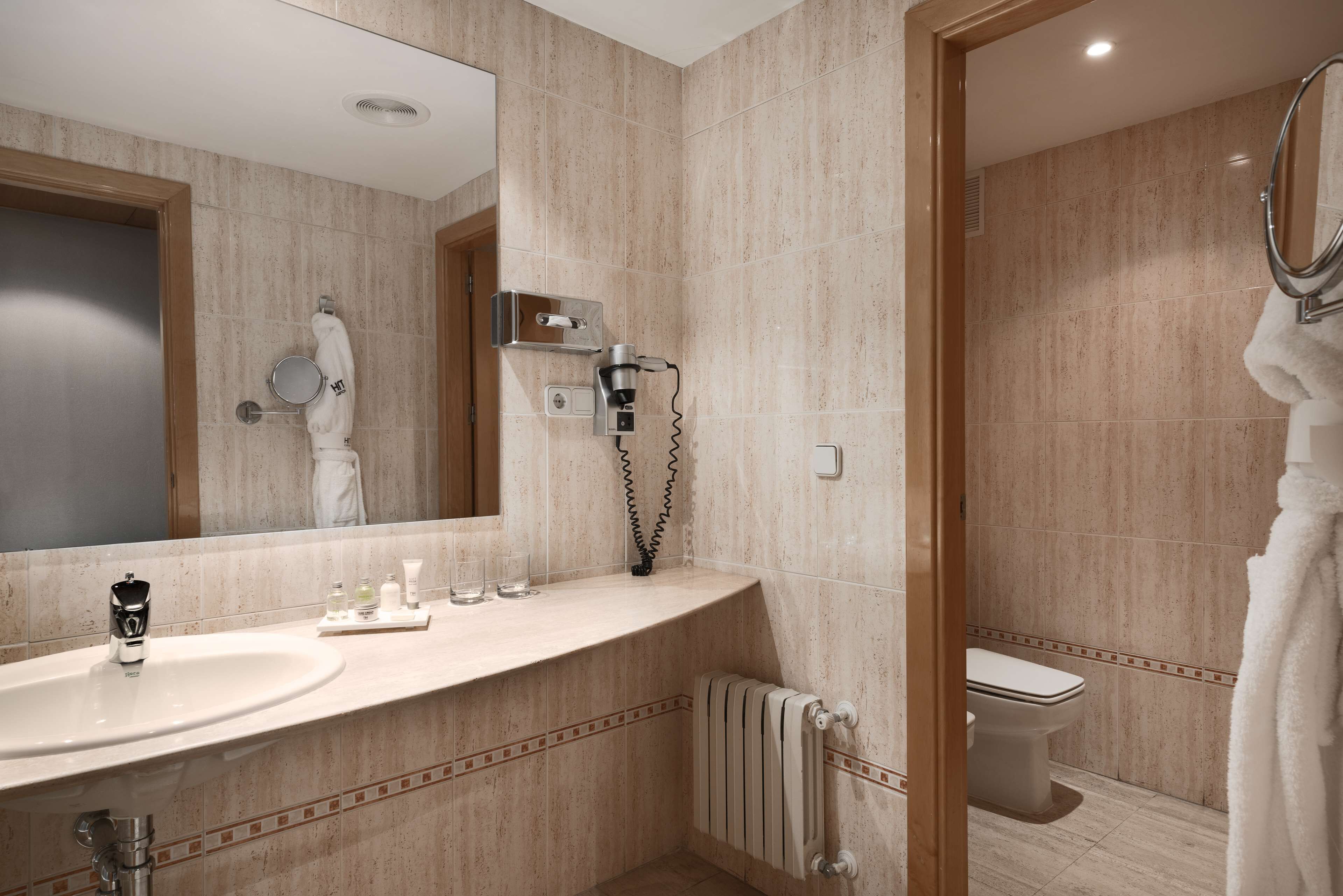 eco-friendly toiletries, hair dryer, towels