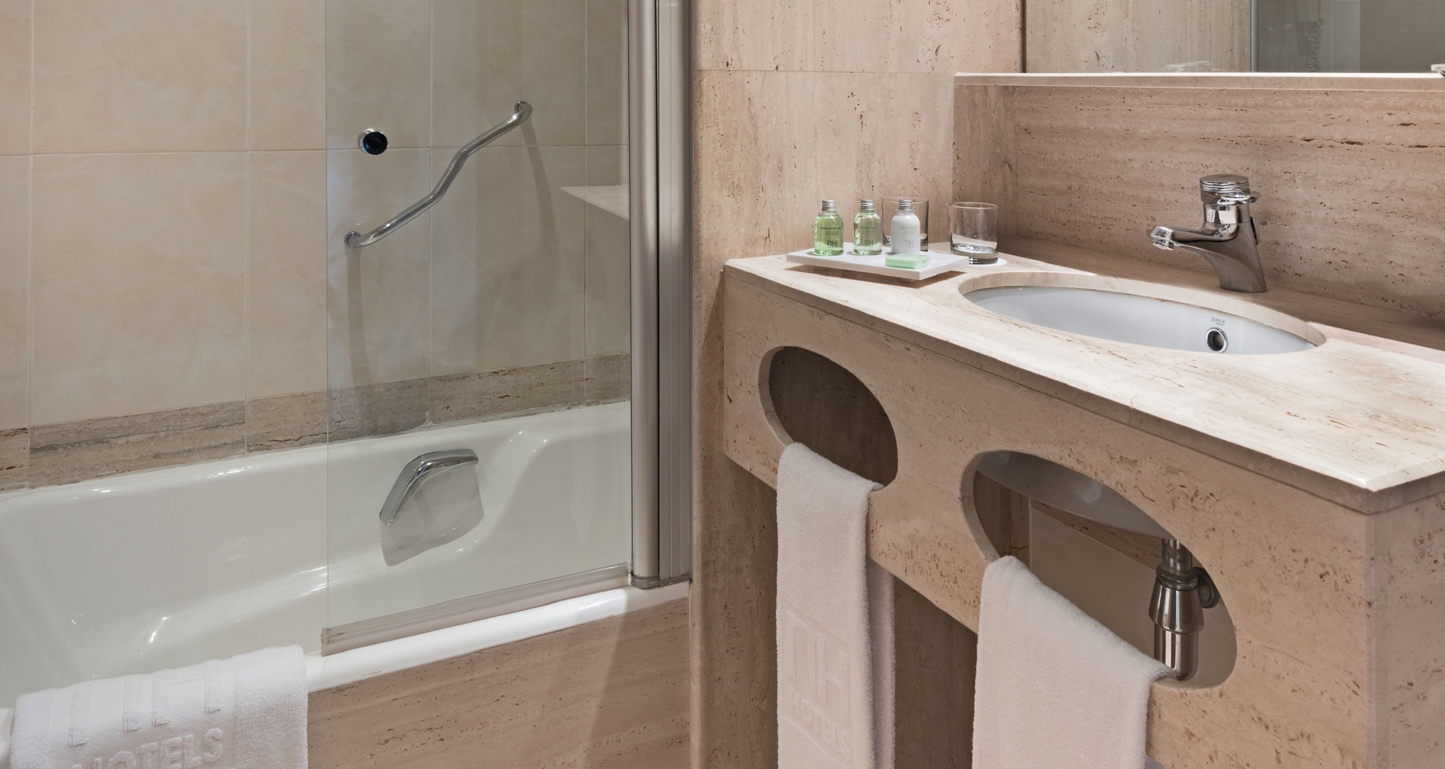 bathtub, eco-friendly toiletries, hair dryer, bidet