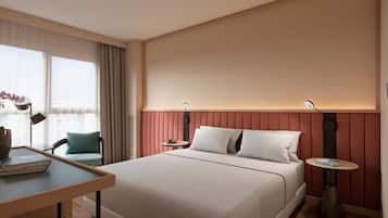 Luxe beddengoed, een minibar, een kluis op de kamer, een bureau