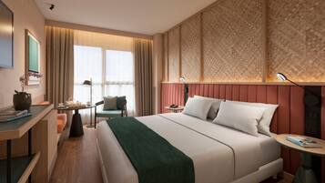 Luxe beddengoed, een minibar, een kluis op de kamer, een bureau