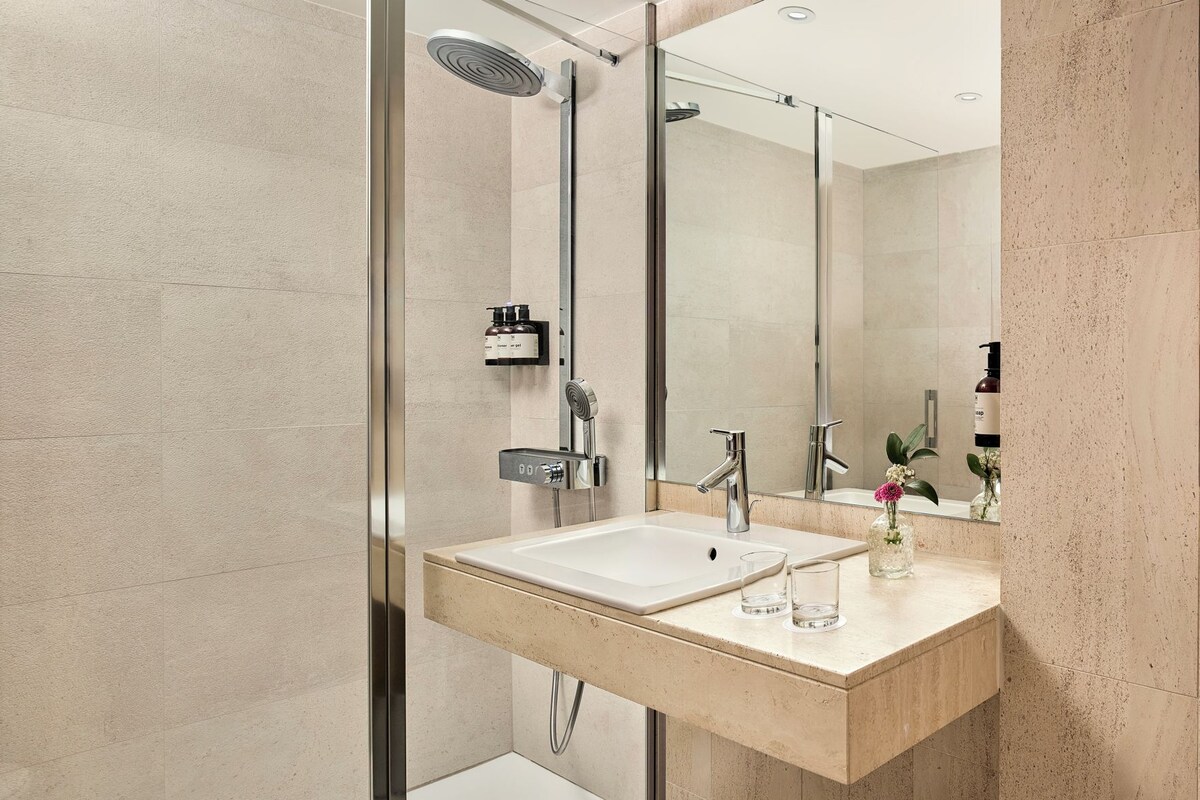 Bathroom | Shower, rainfall showerhead, eco-friendly toiletries, hair dryer