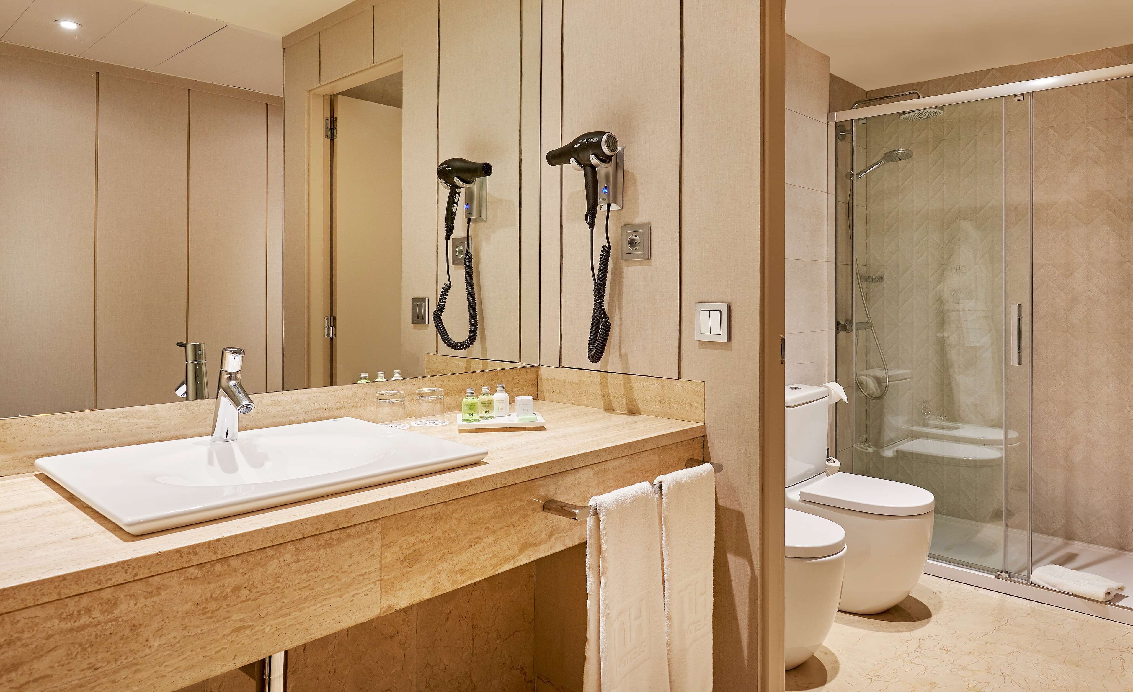 deep-soaking bathtub, rainfall showerhead, eco-friendly toiletries