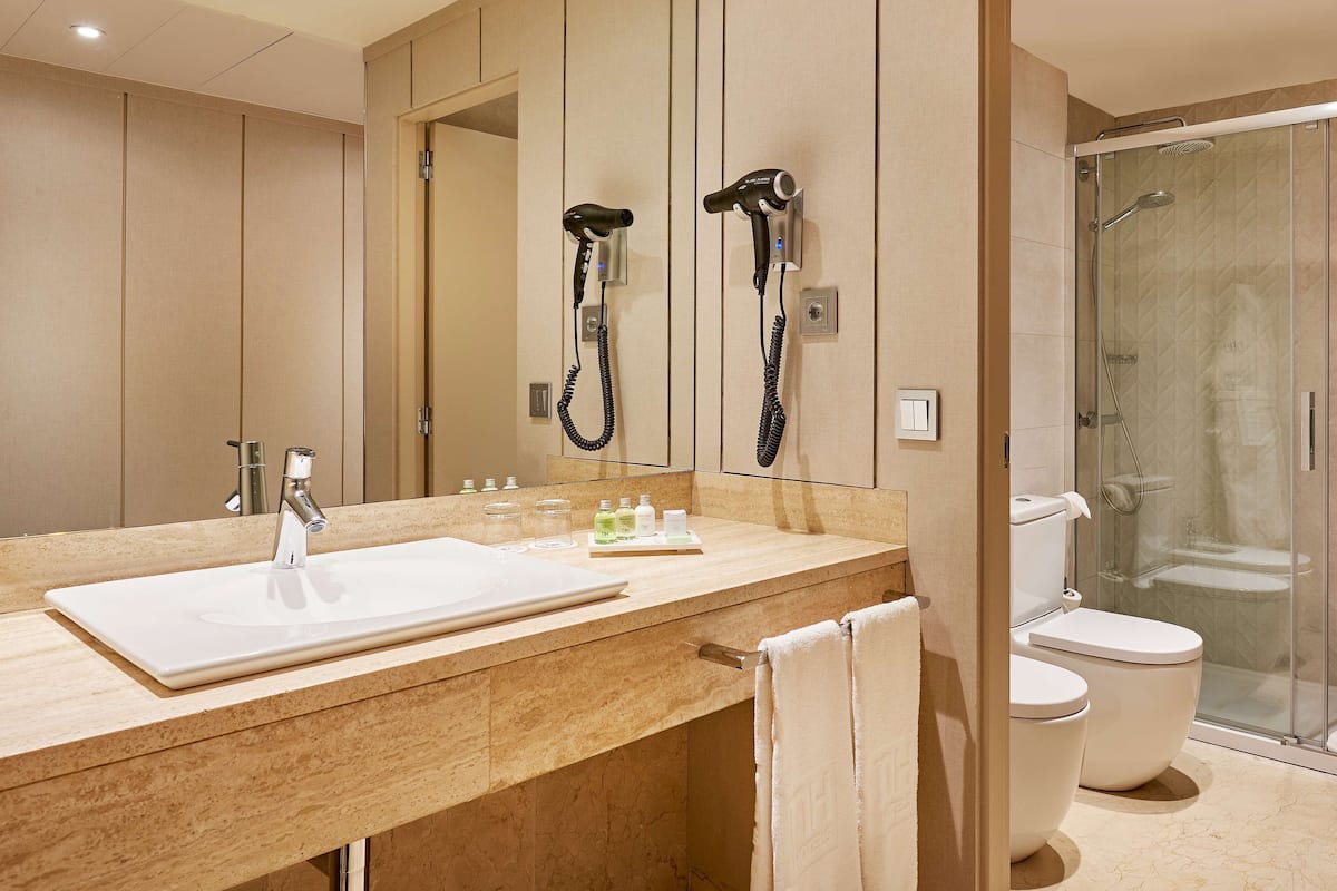 deep-soaking bathtub, rainfall showerhead, eco-friendly toiletries