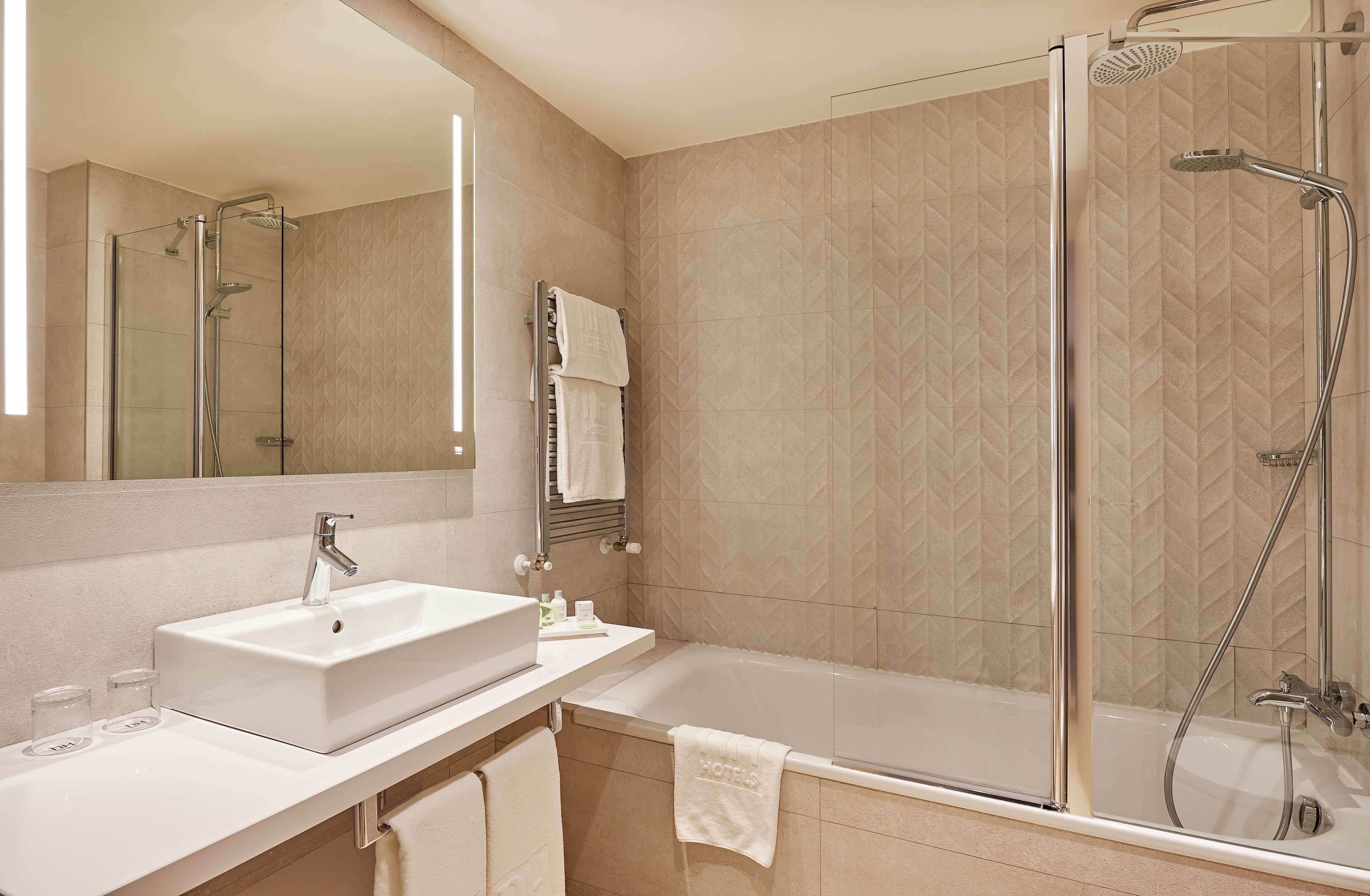 deep-soaking bathtub, rainfall showerhead, eco-friendly toiletries