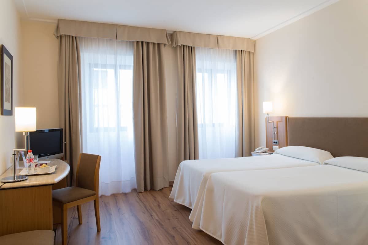 Ropa de cama de alta calidad y minibar