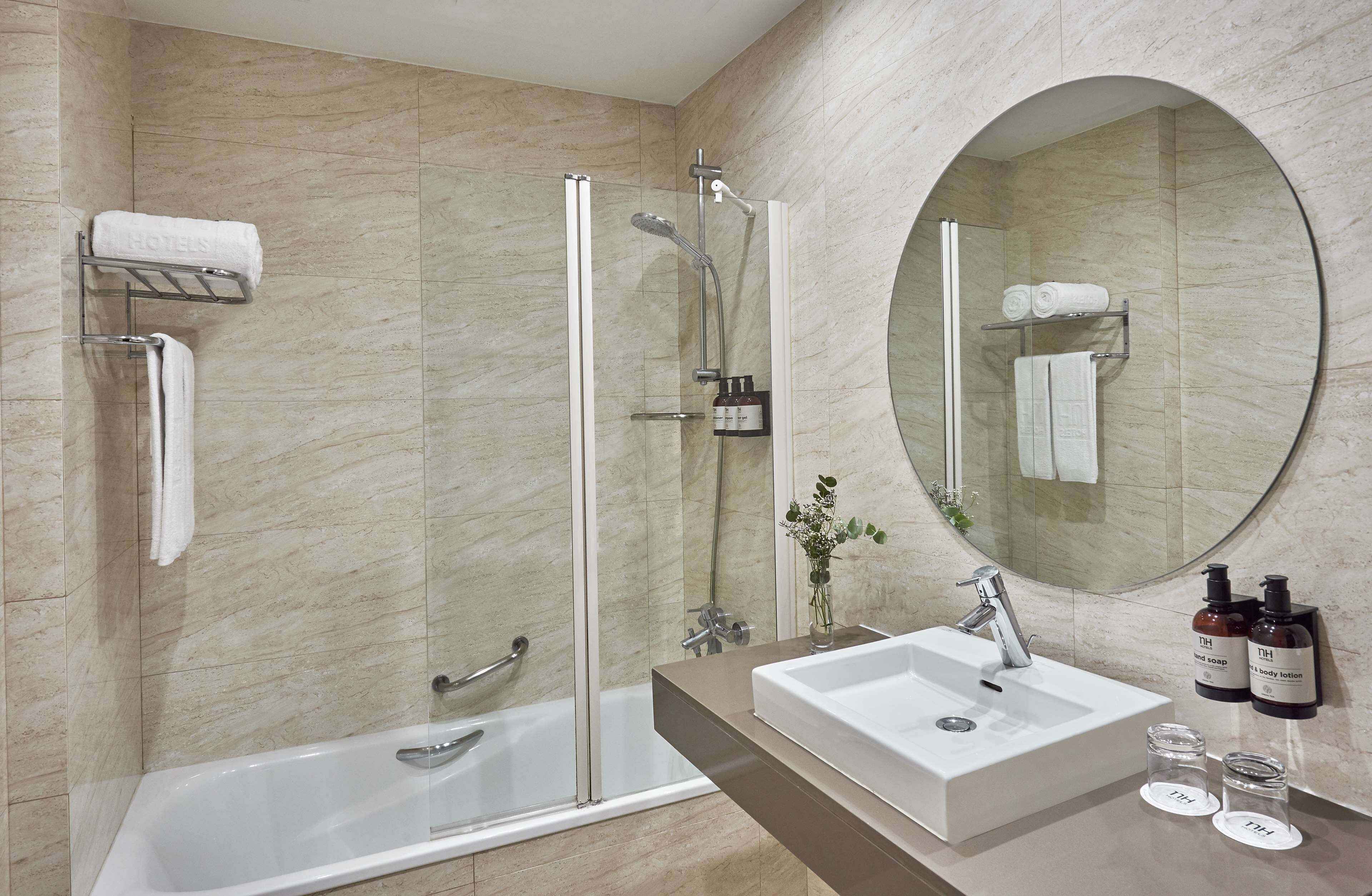 deep-soaking bathtub, rainfall showerhead, eco-friendly toiletries