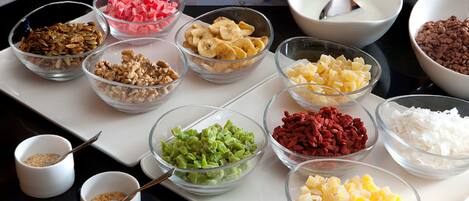 A variety of food items in bowls on a table.