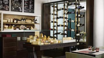 A wine cellar with a wine rack and cheese display.