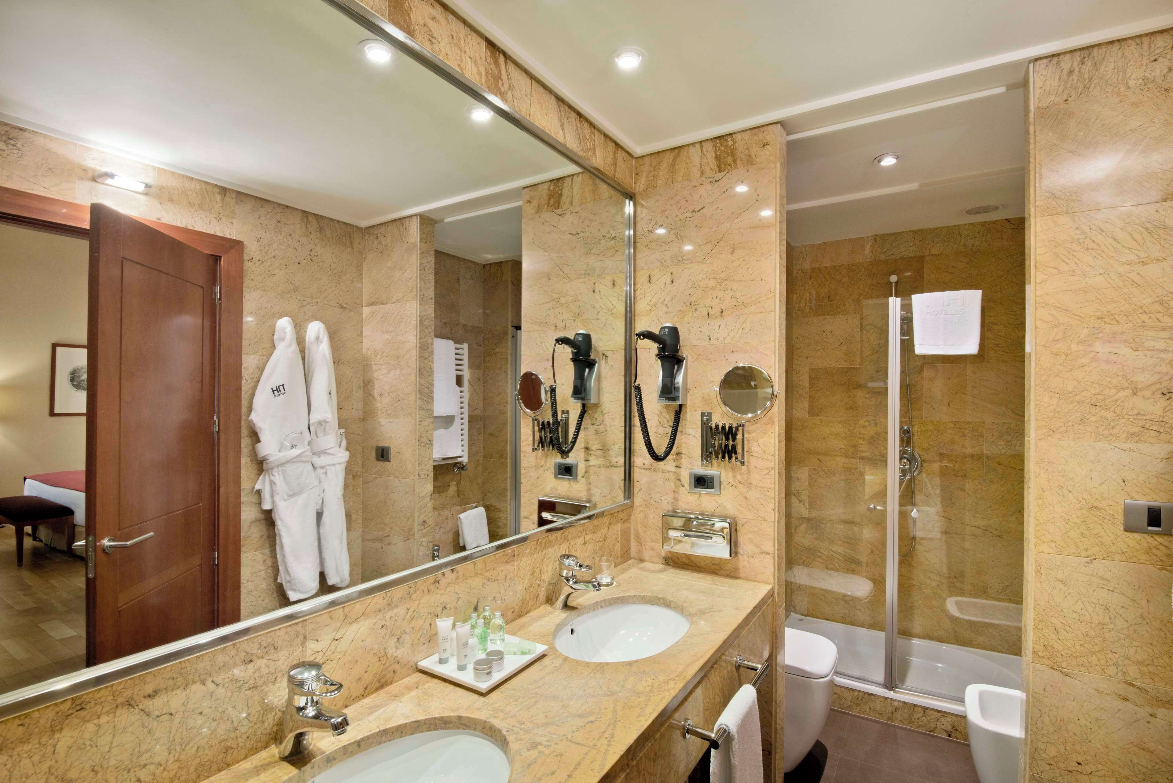 eco-friendly toiletries, hair dryer, towels