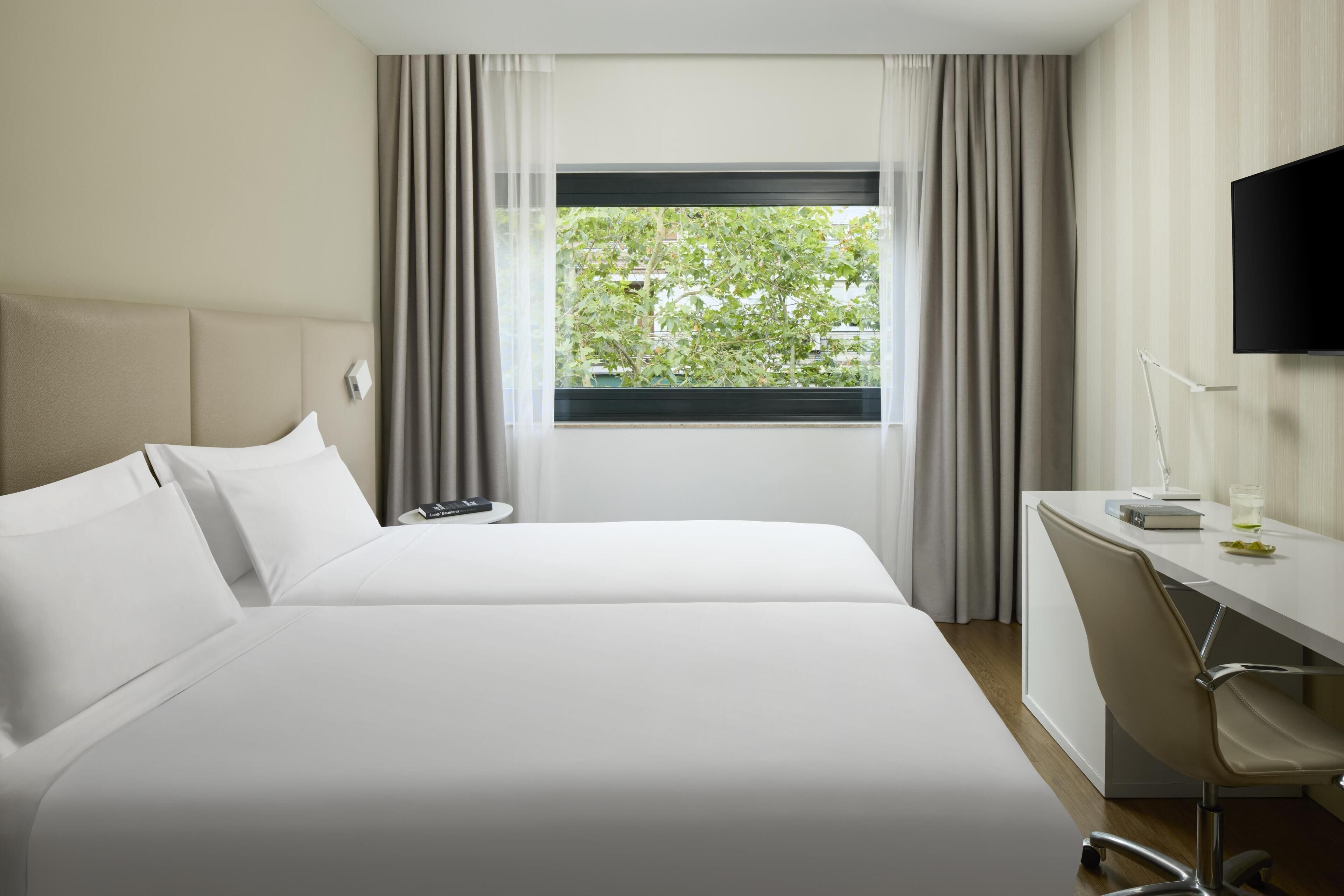 Hypo-allergenic bedding, minibar, in-room safe, desk